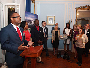 Deputy Premier of Nevis and Minister of Tourism Hon. Mark Brantley addresses invitees, among them travel agents, at a cocktail reception at the office of the High Commission of St. Kitts and Nevis in London. Looking on are (right) Chief Executive Officer of the St. Kitts Tourism Authority Raquel Brown and (second from right) Chief Executive Officer of the Nevis Tourism Authority Greg Phillip